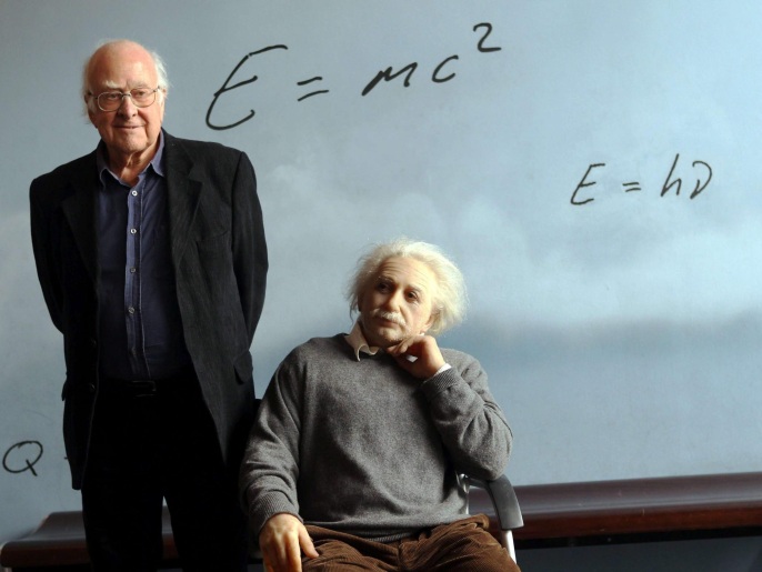 (FILES) British physicist Peter Higgs, creator of the Higgs boson, poses for photographs next to a statue of Albert Einstein at the CosmoCaixa science museum in Barcelona, Spain, 06 November 2012. Two scientists have won the Nobel prize in physics for their work on the theory of the Higgs boson, it was announced 08 October 2013. Peter Higgs, from the UK, and Francois Englert from Belgium, shared the prize. EPA/TONI ALBIR *** Local Caption *** 50585100