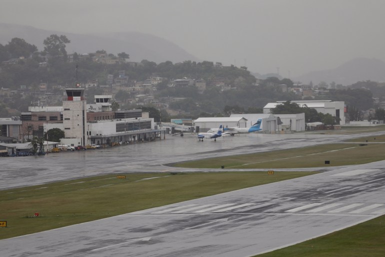 Airplanes are parked at a terminal at Toncontin International Airport after flights were cancelled due to Tropical Storm Sara, in Tegucigalpa, Honduras November 15, 2024. REUTERS/Fredy Rodriguez